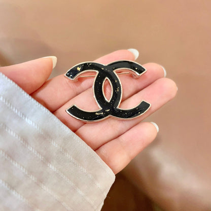 CHANEL 26S DOUBLE C LOGO BROOCH IN BLACK ENAMEL 631919