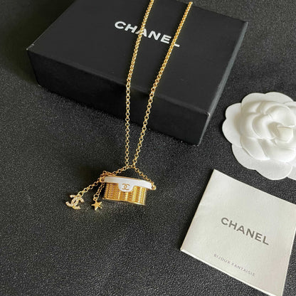CHANEL 26S DOUBLE C LOGO MINI VANITY BAG PENDANT NECKLACE WITH STAR CHARM IN GOLD METAL 633291