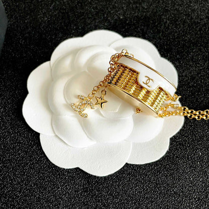 CHANEL 26S DOUBLE C LOGO MINI VANITY BAG PENDANT NECKLACE WITH STAR CHARM IN GOLD METAL 633291