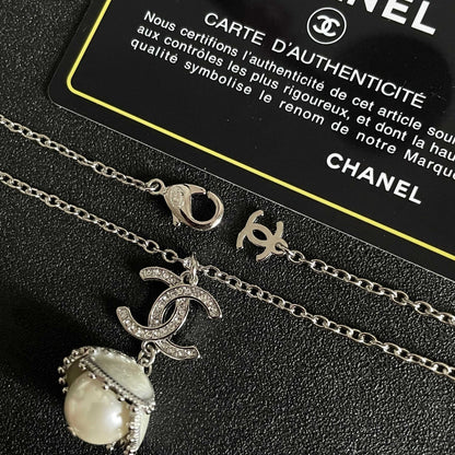 CHANEL 26S DOUBLE C LOGO PEARL DROP PENDANT NECKLACE WITH CRYSTAL HALO IN SILVER METAL 633293