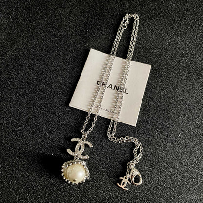 CHANEL 26S DOUBLE C LOGO PEARL DROP PENDANT NECKLACE WITH CRYSTAL HALO IN SILVER METAL 633293