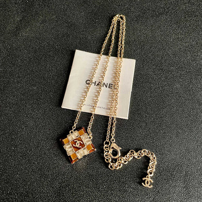 CHANEL 26S DOUBLE C LOGO AMBER CRYSTAL SQUARE PENDANT NECKLACE IN GOLD METAL 633294