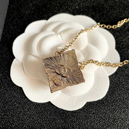 CHANEL 26S DOUBLE C LOGO AMBER CRYSTAL SQUARE PENDANT NECKLACE IN GOLD METAL 633294