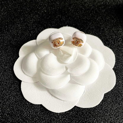CHANEL 26S CHANEL CC LOGO PAVE CRYSTAL STUD EARRINGS IN WHITE ENAMEL WITH GOLD METAL 633309