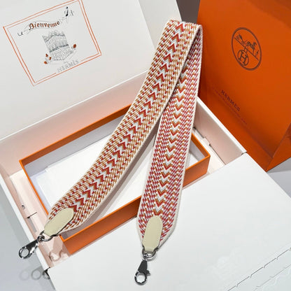 25S HERMES BAG STRAP ORANGE AND RED PATTERN 85 IN CANVAS SILVER HARDWARE