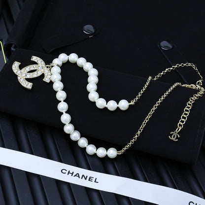 25P PEARL NECKLACE IN LIGHT GOLD STAR & HEART DOUBLE C PENDANT
