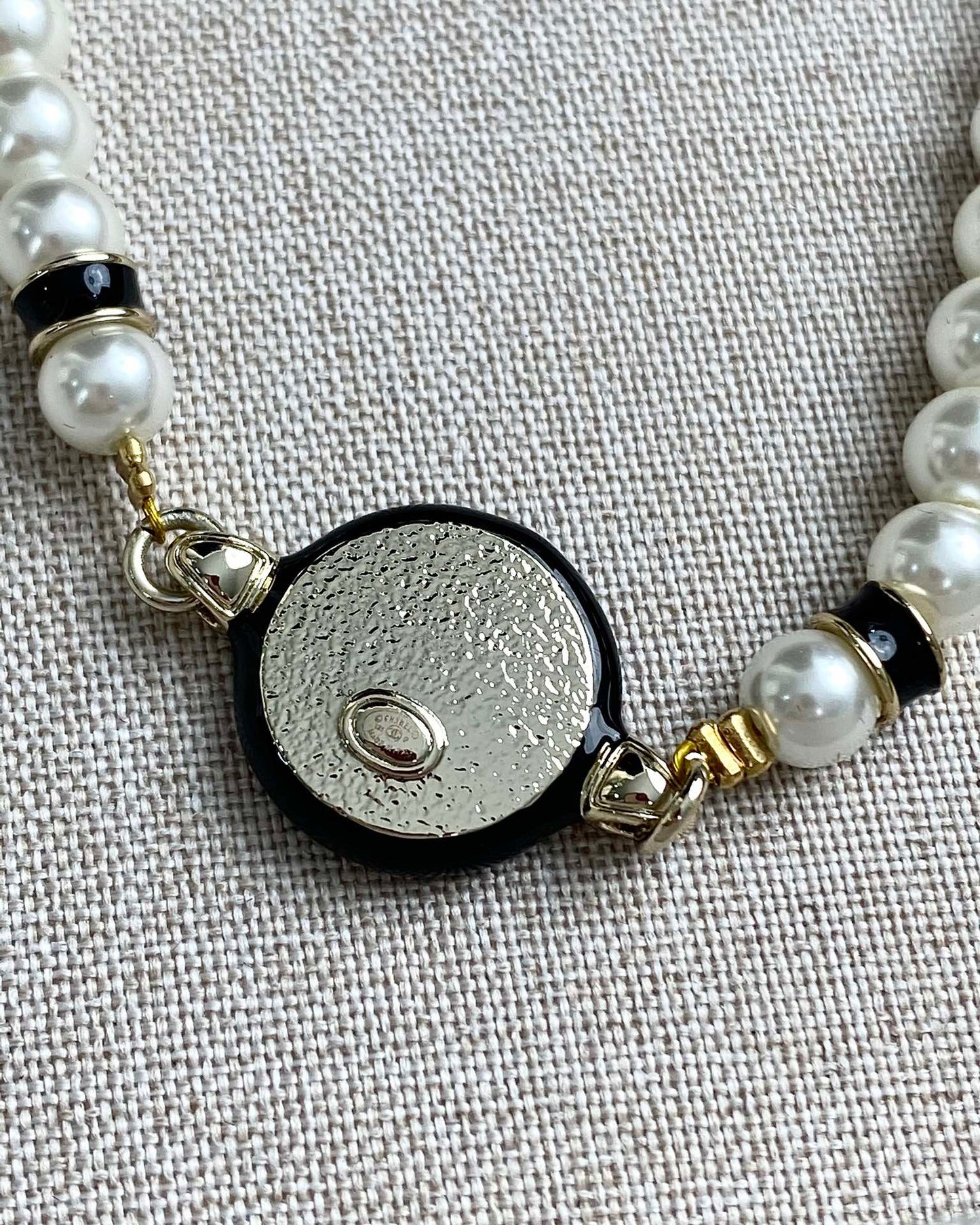 Classic CC bracelet with faux pearls and black resin.