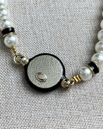Classic CC bracelet with faux pearls and black resin.