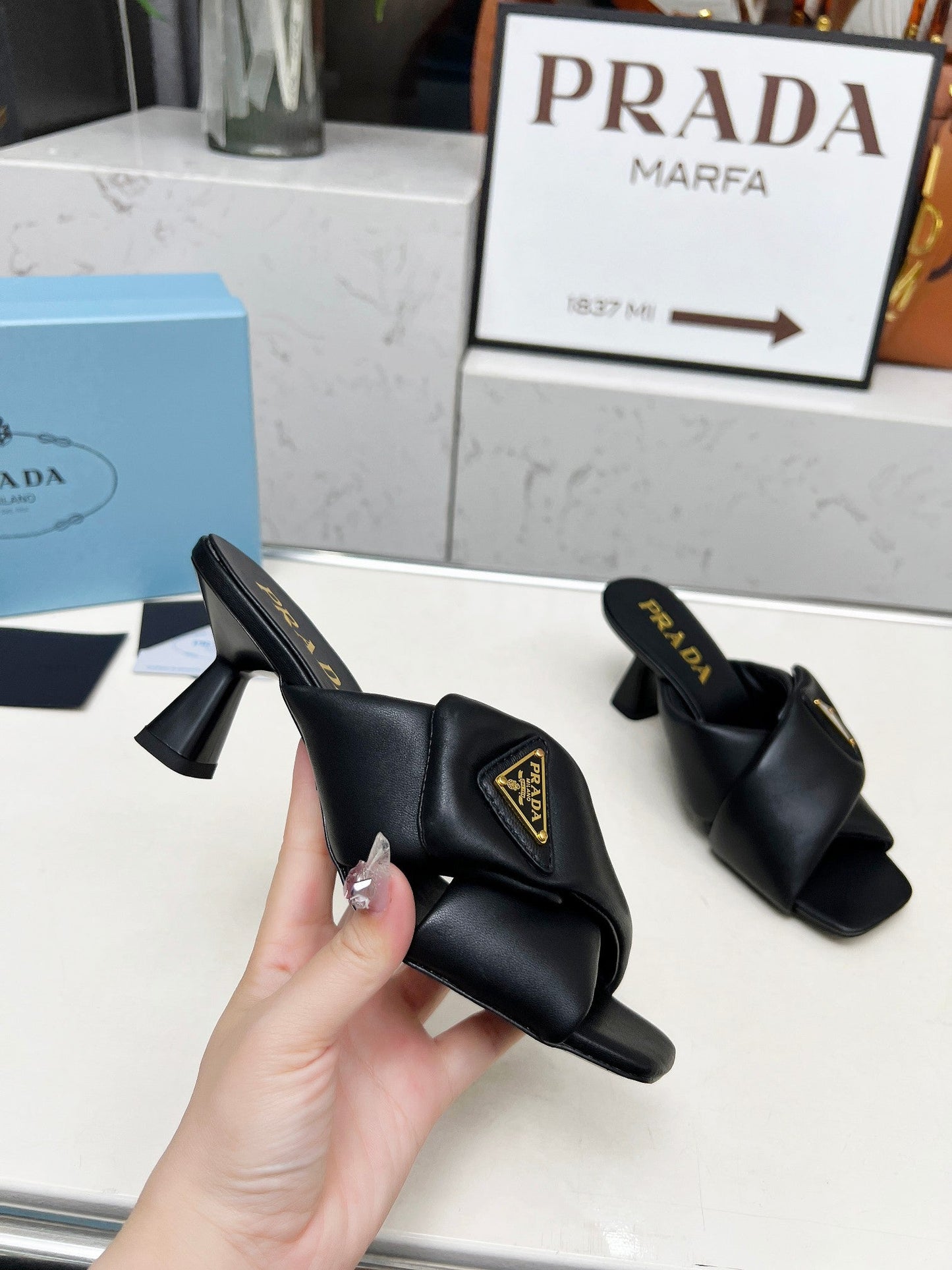 PRA CROSS MULE HEELS IN BLACK CALFSKIN WITH PADDED STRAPS