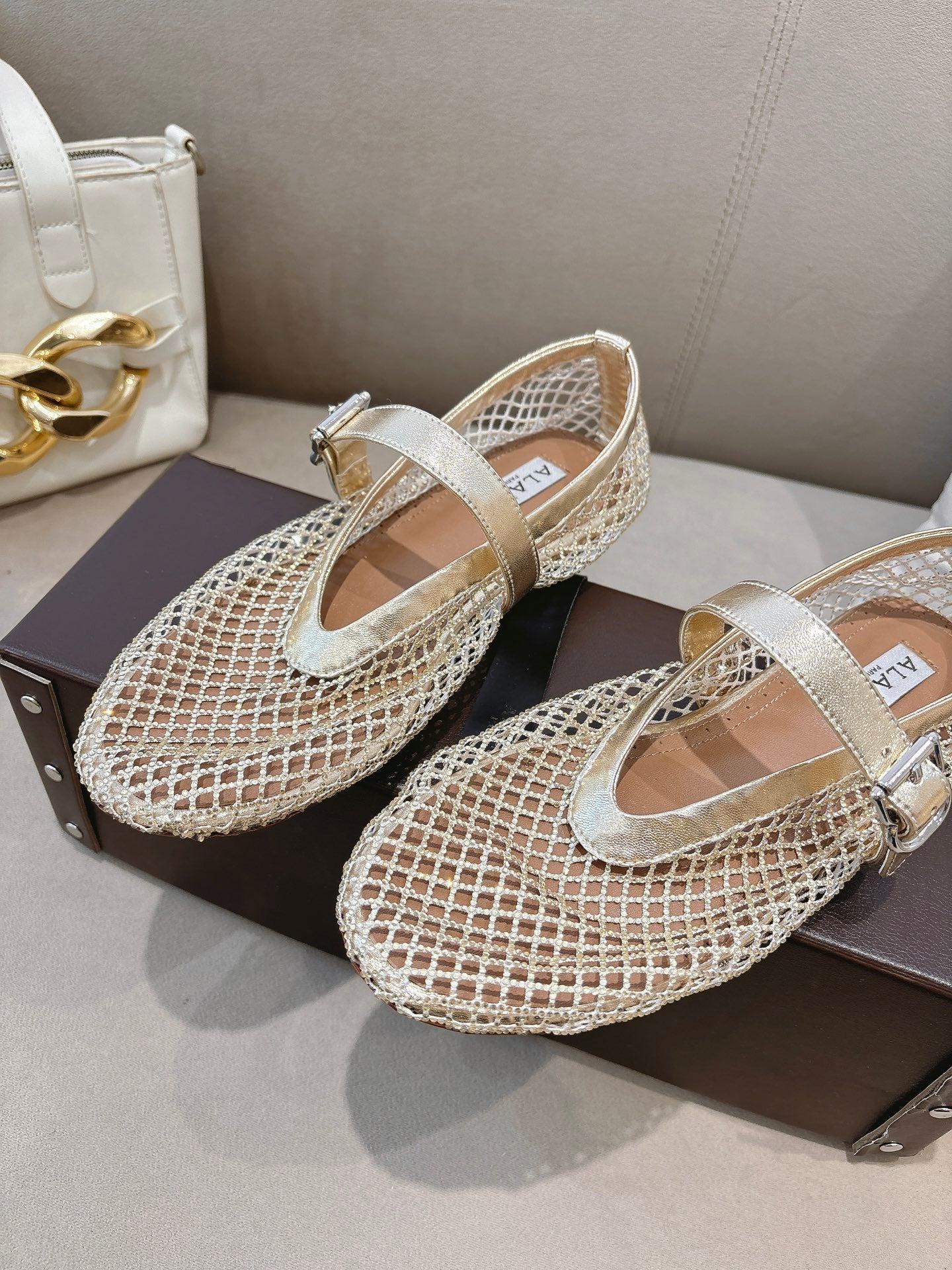 ALAIA 26S MESH FLATS IN LIGHT GOLD LAMBSKIN
