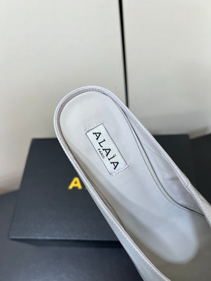 ALAIA WEDGE MULES 25S IN WHITE LAMBSKIN