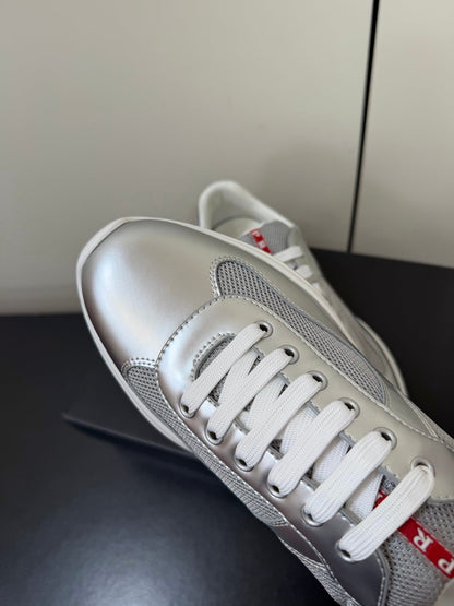 PRADA 26S SNEAKERS IN SILVER CALFSKIN AND WHITE MESH