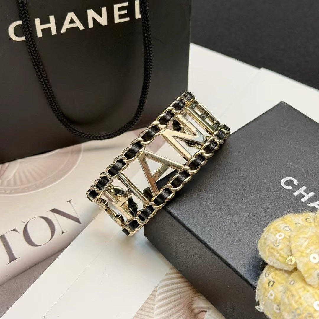 CHANEL 26S CHANEL LOGO OPEN CUFF LEATHER CHAIN BRACELET IN GOLD METAL 630836