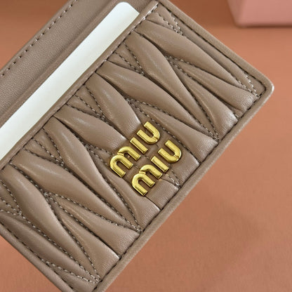 MM MATELASSÉ CARD HOLDER 10.5 IN BEIGE CALFSKIN