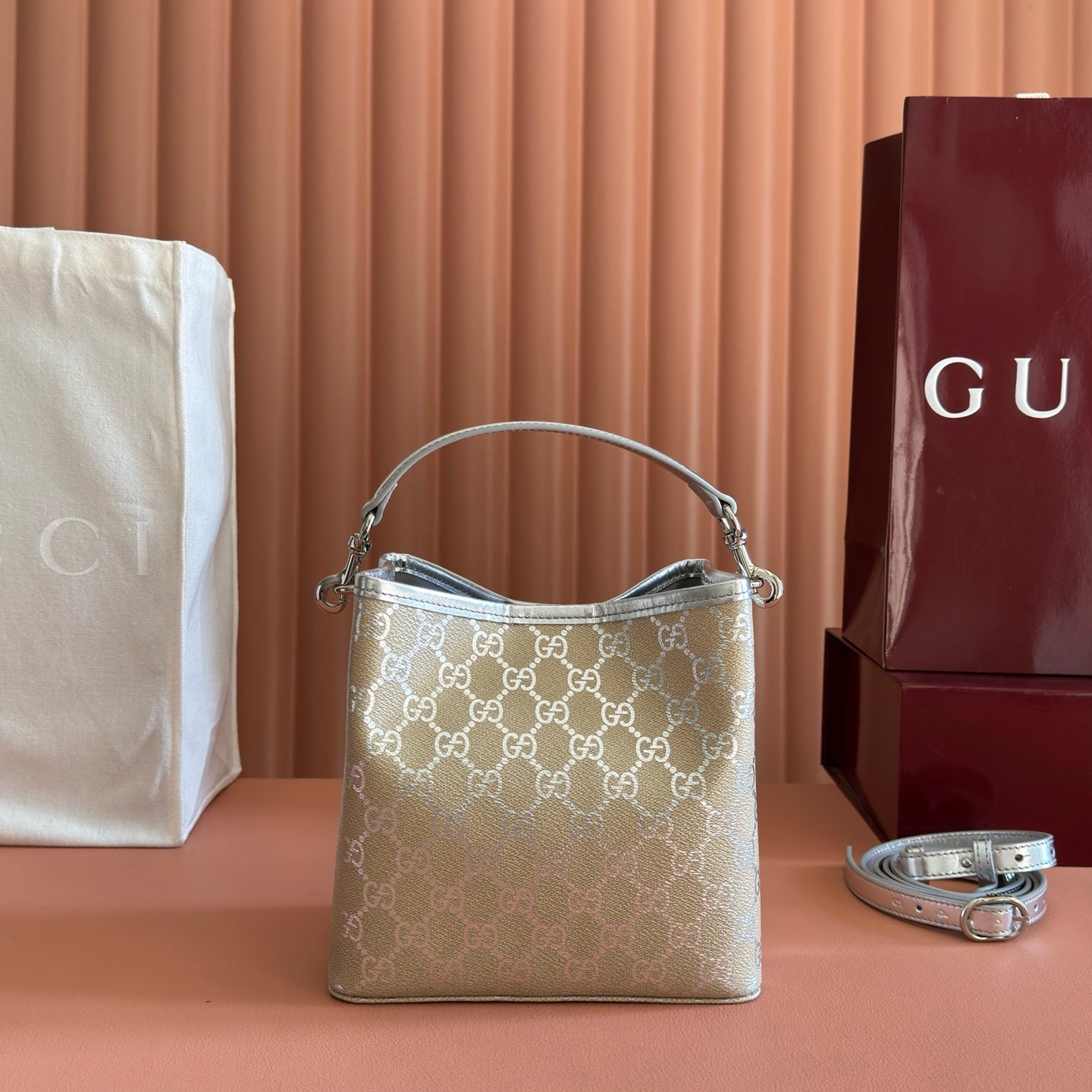 GUCCI 26S GG EMBLEM BUCKET BAG 19 IN BEIGE AND SILVER CANVAS