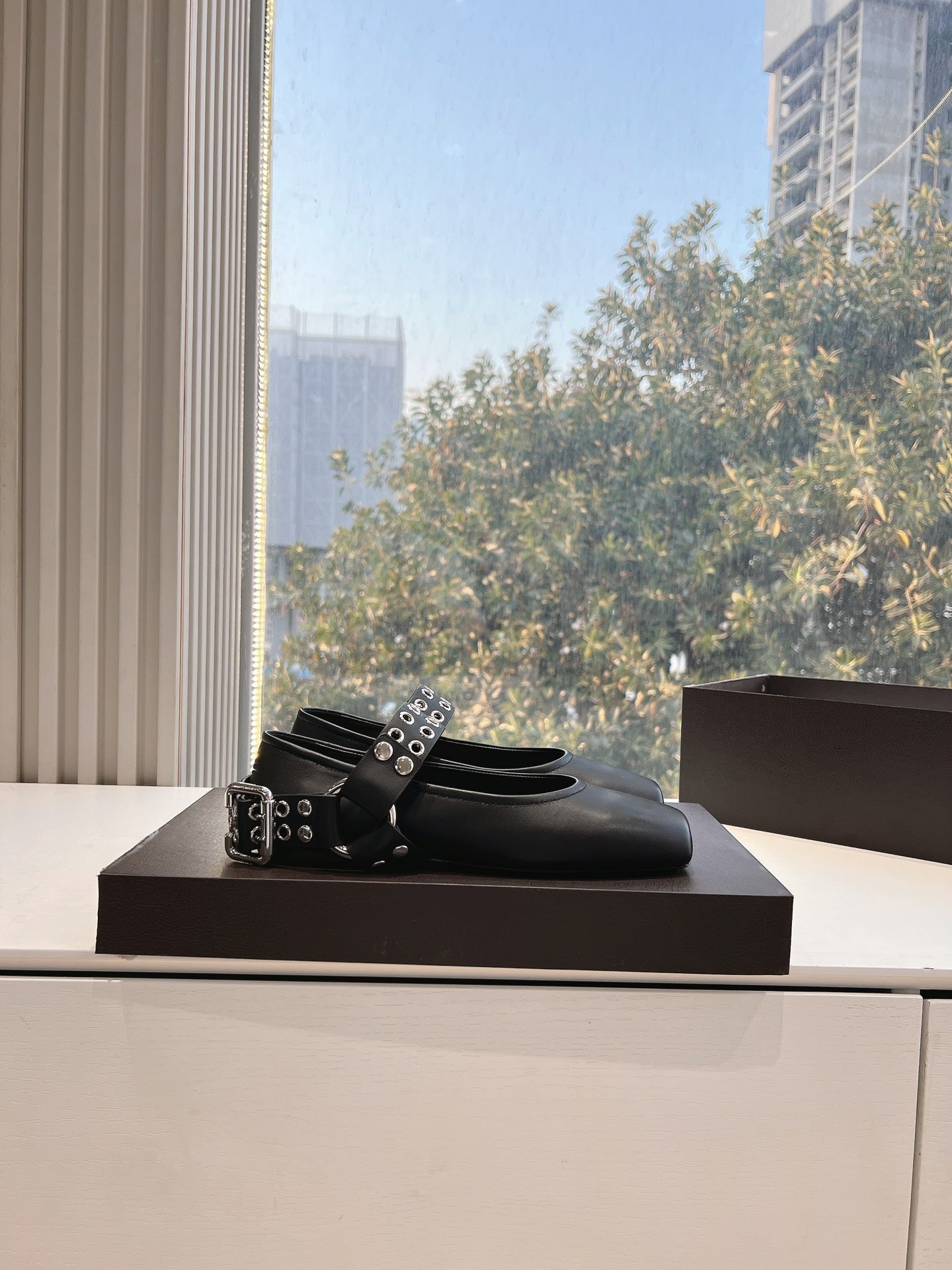 ALAIA 26S FLATS IN BLACK CALFSKIN WITH SILVER STUD STRAP