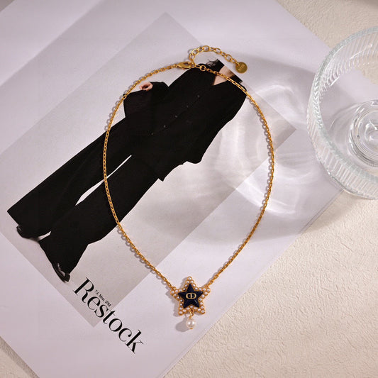 CD 26S PEARL STAR LOGO PENDANT NECKLACE IN GOLD TONE METAL