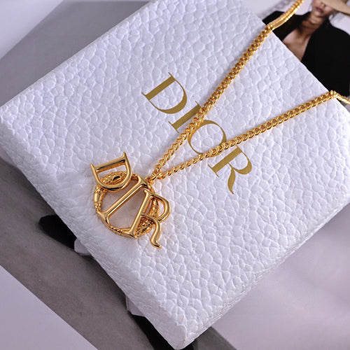 CD 26S SCULPTED LOGO PENDANT NECKLACE IN GOLD TONE METAL 631785