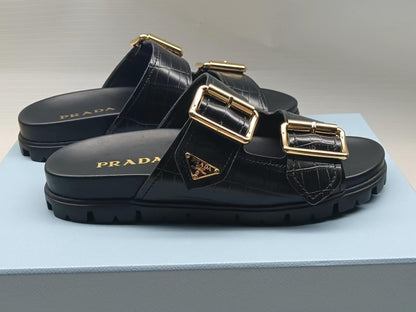 PRADA 26S STRAP SLIDES IN BLACK CROC EMBOSSED CALFSKIN GOLD HARDWARE