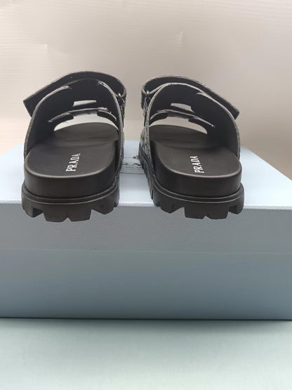 PRADA 26S STRAP SLIDES IN BLACK CROC EMBOSSED CALFSKIN