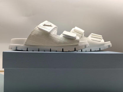 PRADA 26S STRAP SLIDES IN IVORY WHITE CROC EMBOSSED CALFSKIN