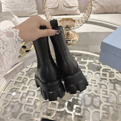PRADA 26S MONOLITH CHELSEA BOOTS IN BLACK CALFSKIN AND FABRIC