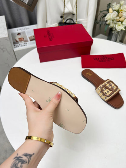 Vlogo embellished leather-trimmed raffia slides tan