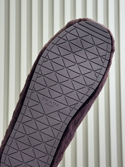 PRADA 25S CLOGS IN WINE RED SHEARLING