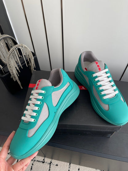 PRADA 26S AMERICA CUP SNEAKERS IN TEAL BLUE SOFT RUBBER AND BIKE FABRIC