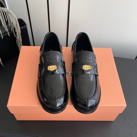 MIUMIU 26S PENNY LOAFERS IN BLACK GLOSSY CALFSKIN GOLD HARDWARE