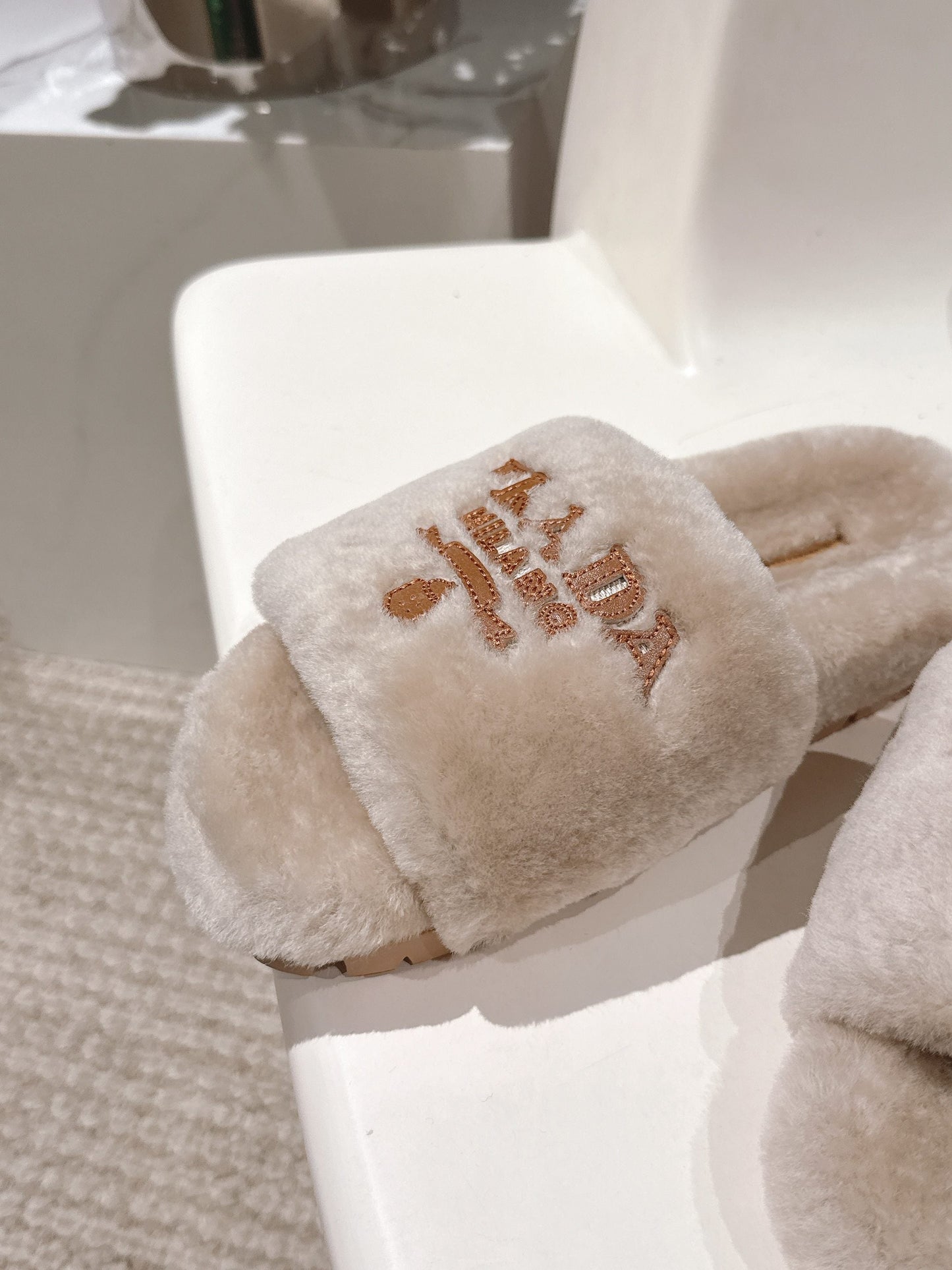 PRADA 25S FLAT MULES IN WARM TAUPE RABBIT FUR